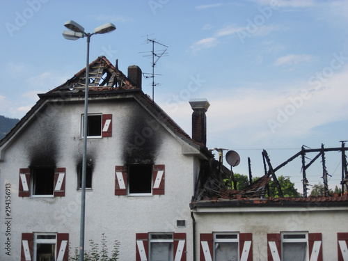 Damaged hotel building after burned by fire, natural disaster. Bad Reichenhall, Germany