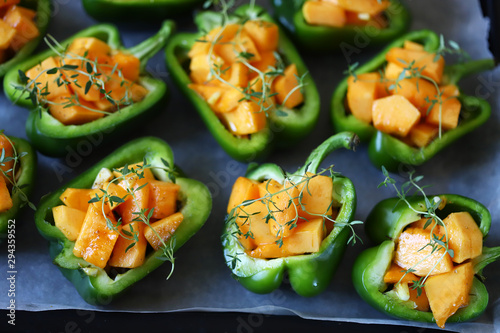 Paprika pepper stuffed with pumpkin slices. Recipe. Autumn food. Vegan food. Diet concept. Selective focus. Macro.