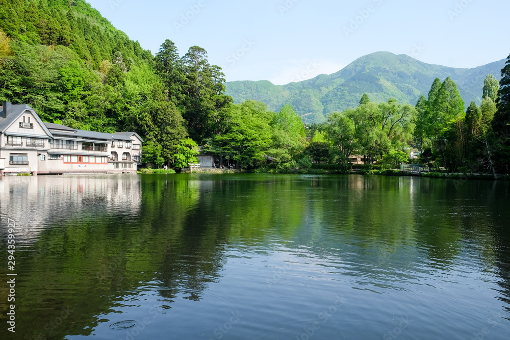 Landscape of The Kinrin Lake with surrounded by trees in Background and water reflection, onsen town, Yufuin, Oita, Kyushu, Japan. Landscape of The Kinrin Lake with surrounded by trees in Background and water reflection, onsen town, Yufuin, Oita, Kyushu, Japan.