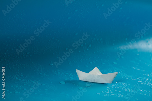 Paper ship sailing on big wave © lijphoto