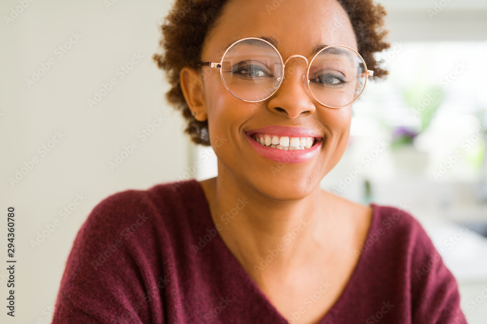 Beautiful young african woman with afro hair wearing glasses Beautiful young african woman with afro hair wearing glasses