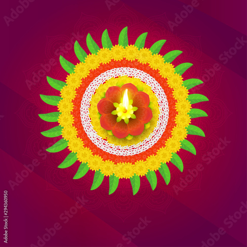 Beautiful Rangoli design made by flowers and mango leaves with illuminated earthen lamp on shiny ornamental background for Diwali festival celebration.