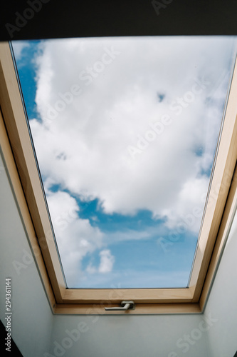 Canvas Print Roof Skylight Window and Blue Sky with Clouds