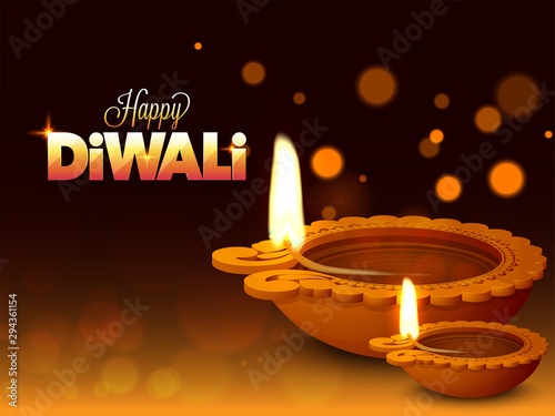 Illuminated oil lamps (Diya) on shiny bokeh background for Happy Diwali celebration concept.