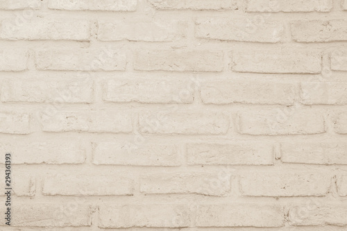 Wall cream brick wall texture background in room at subway. Brickwork stonework interior  rock old clean concrete grid uneven abstract weathered bricks tile design  horizontal architecture wallpaper.