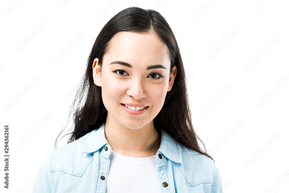 attractive and smiling asian woman in denim shirt looking at camera isolated on white attractive and smiling asian woman in denim shirt looking at camera isolated on white