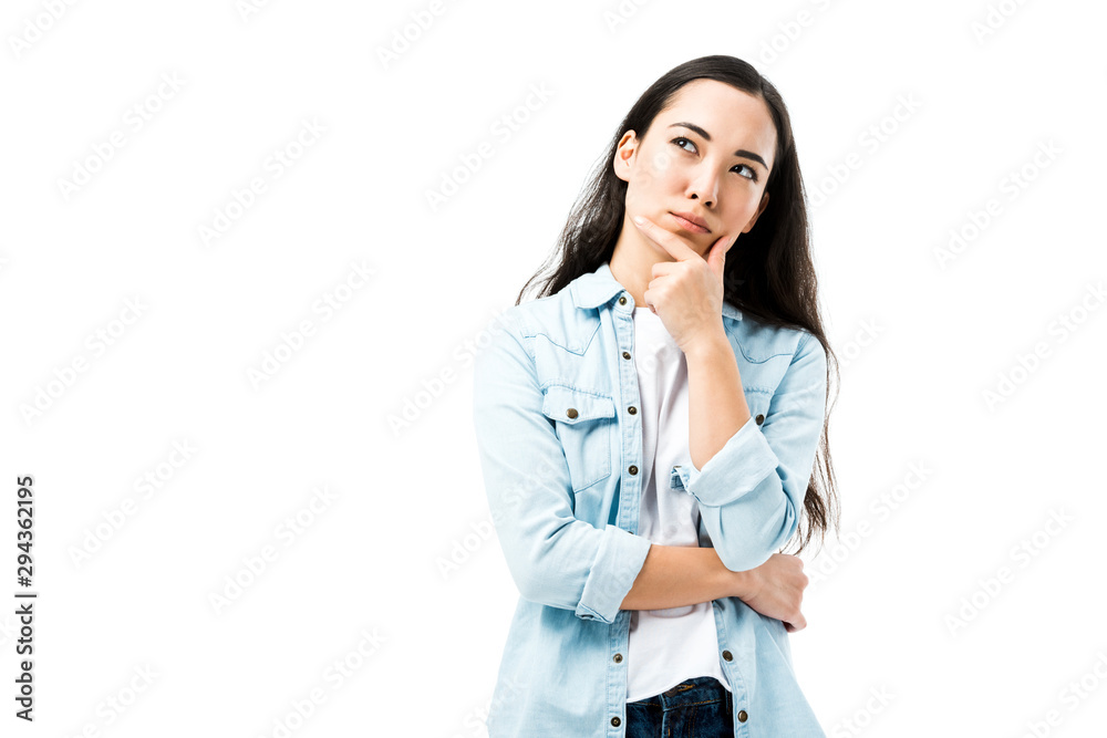 attractive and pensive asian woman in denim shirt looking away isolated on white attractive and pensive asian woman in denim shirt looking away isolated on white