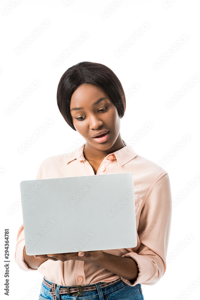 smiling african american woman in shirt using laptop isolated on white smiling african american woman in shirt using laptop isolated on white