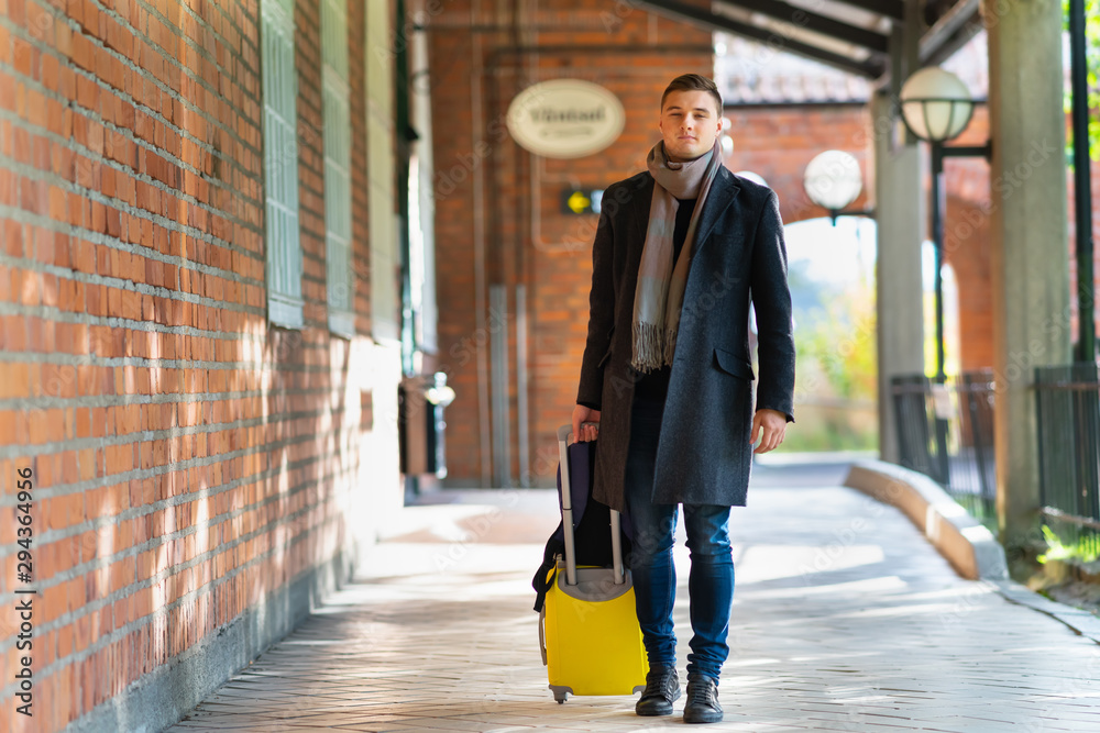 Trendy young man in warm winter clothing