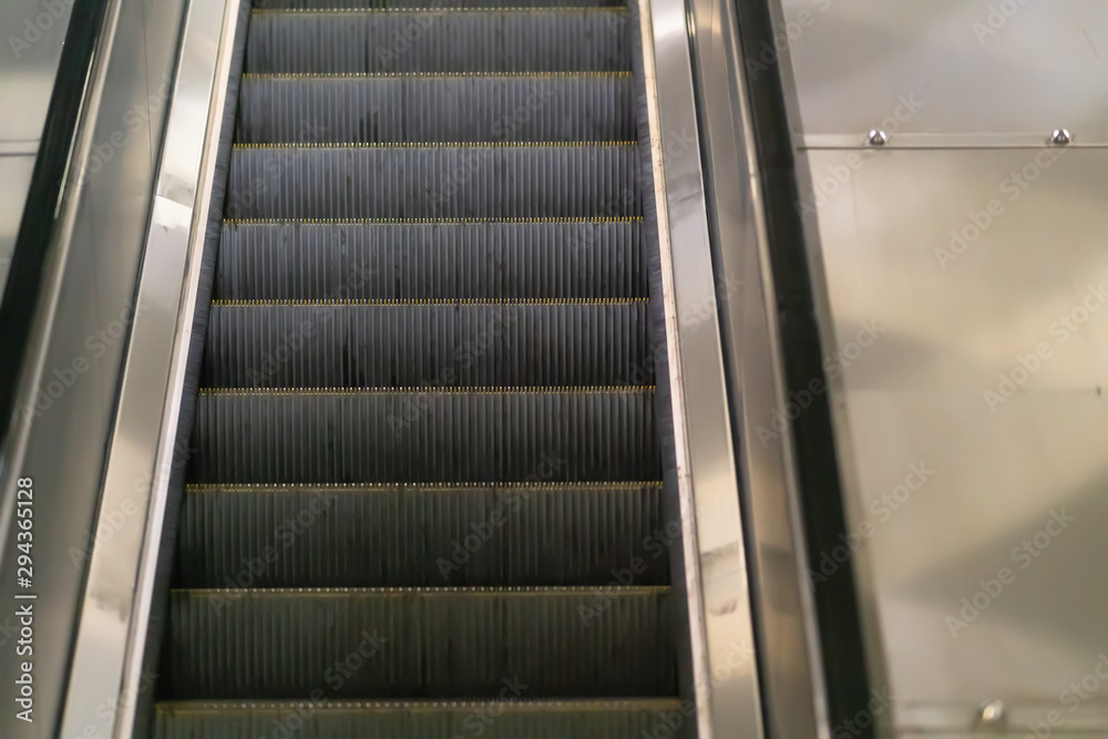 Close up on the treads of a moving escalator Close up on the treads of a moving escalator