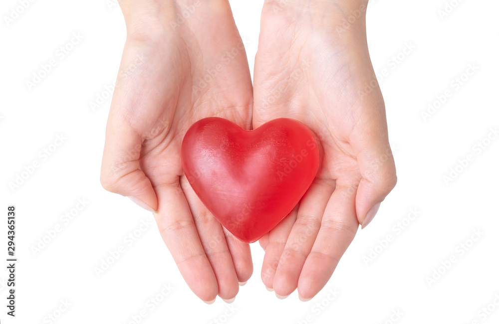 The soap in a shape of a heart in female hands. Romantic Valentine's Day Gift. Handful of love