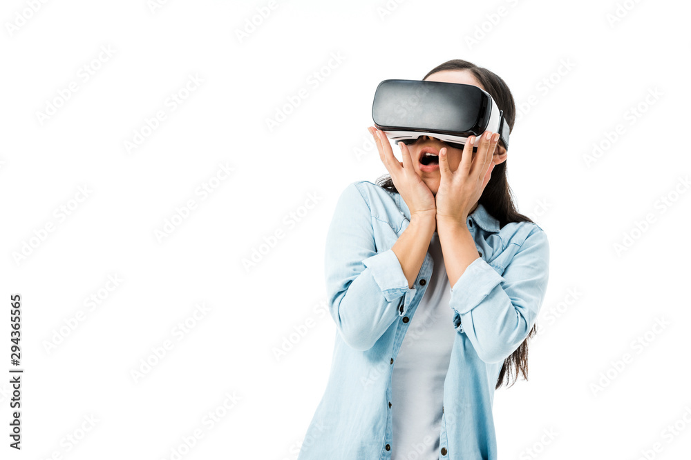 shocked woman in denim shirt with virtual reality headset isolated on white shocked woman in denim shirt with virtual reality headset isolated on white