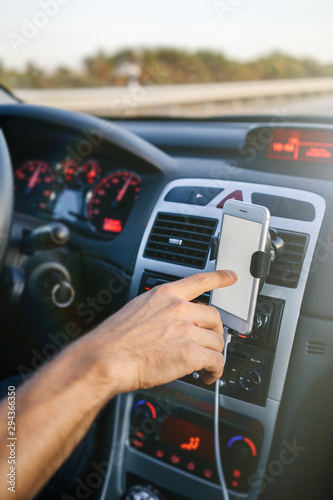 Man using phone while driving © Dani