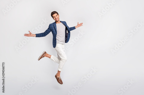 Full length body size view of his he nice attractive cheerful cheery content director wearing checked blazer jumping enjoying leisure freedom success isolated over light white pastel background