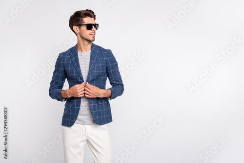 Portrait of his he nice-looking attractive charming lovely content luxury rich wealthy businessman wearing checked blazer cool modern clothing isolated over light white pastel background
