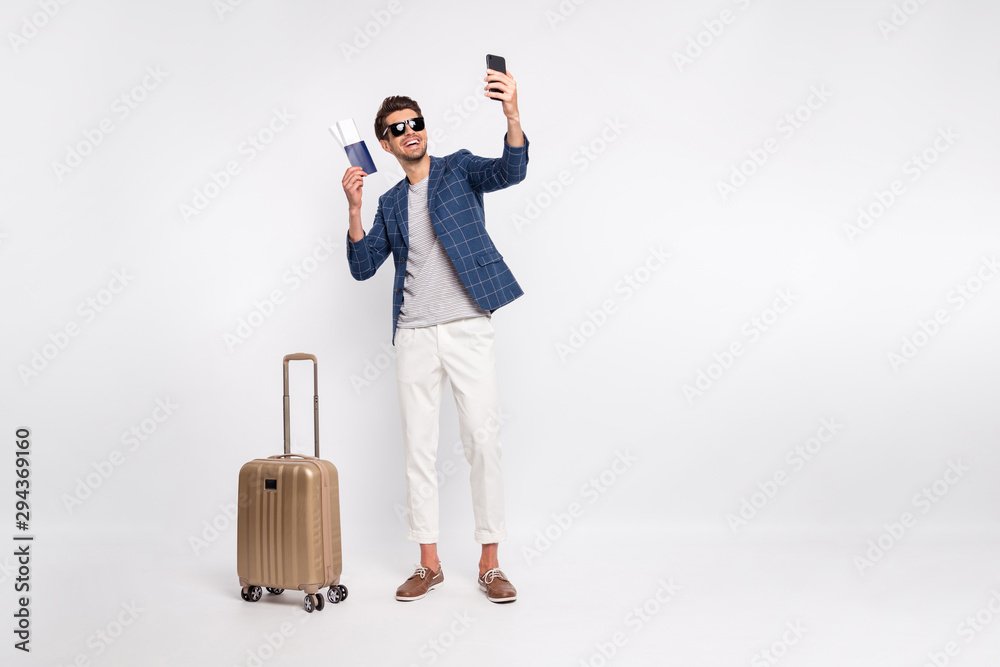 Full length body size view of nice attractive stylish cheerful cheery glad successful businessman tourist wearing blue checked blazer taking making selfie isolated over light white pastel background Full length body size view of nice attractive stylish cheerful cheery glad successful businessman tourist wearing blue checked blazer taking making selfie isolated over light white pastel background