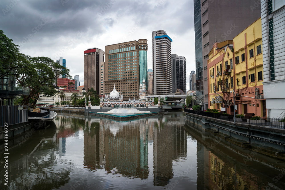 Kuala Lumpur Panorama with Jamek Mosque reflected in Klang and Gombak Rivers, Malaysia