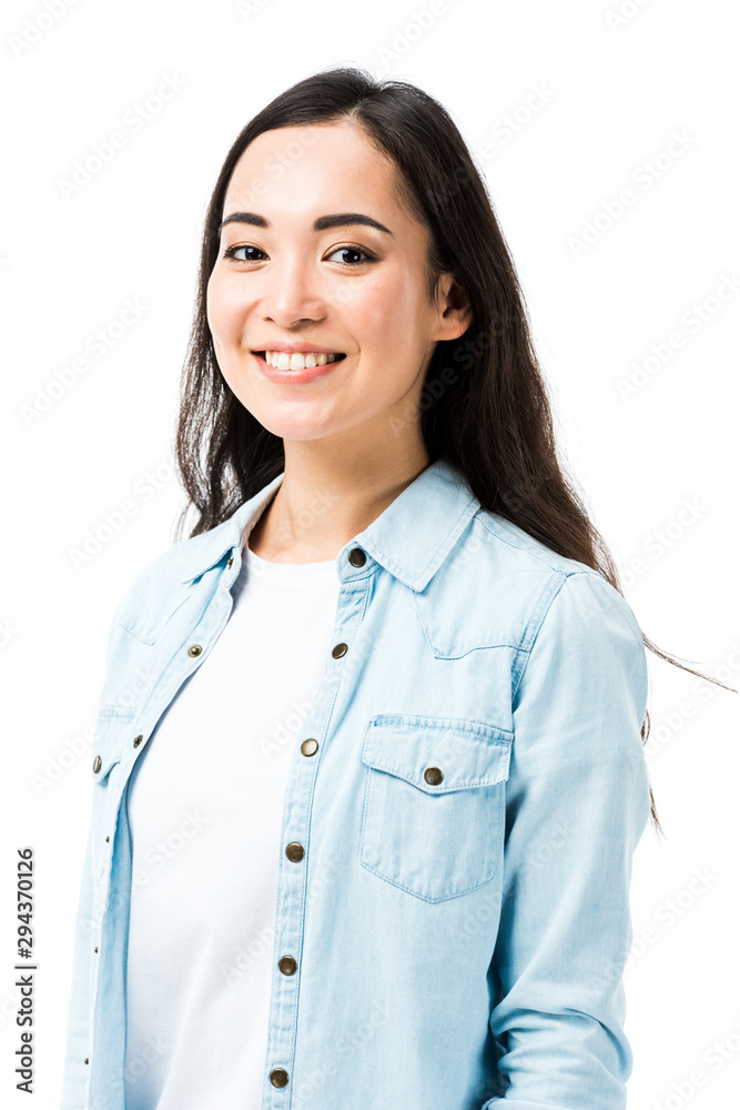 attractive and smiling asian woman in denim shirt looking at camera isolated on white attractive and smiling asian woman in denim shirt looking at camera isolated on white