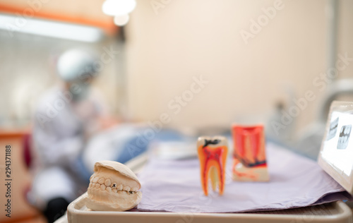 Example implant false teeth and monitor X-ray equipment in dental Clinic, Dentist teeth health care to patient background