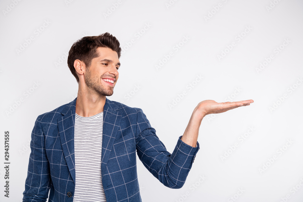 Portrait of his he nice attractive cheerful cheery content businessman agent broker wearing checked blazer holding invisible object on palm isolated over light white pastel background Portrait of his he nice attractive cheerful cheery content businessman agent broker wearing checked blazer holding invisible object on palm isolated over light white pastel background