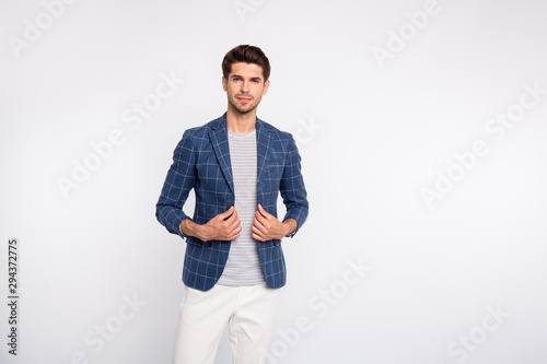 Portrait of gorgeous man touch his blue blazer wear checkered jacket pants trousers isolated over grey background