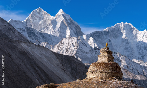 Old Buddhist Stupa on the background of majestic Kangtega peak (6782 m) in Nepal, Himalayas