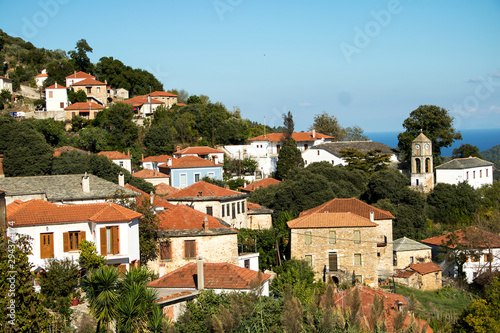 mediterranes bergdorf mit kirche und waldr photo