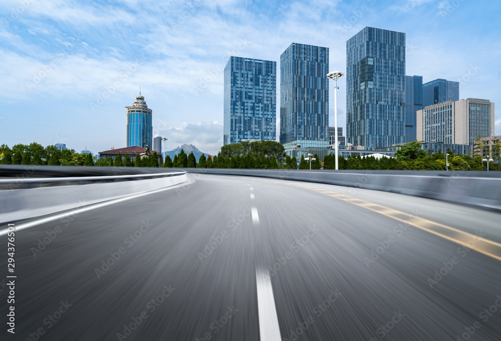 empty highway with cityscape and skyline of qingdao,China.