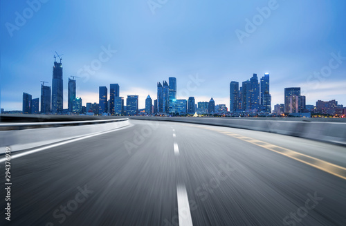 empty highway with cityscape and skyline of qingdao,China.