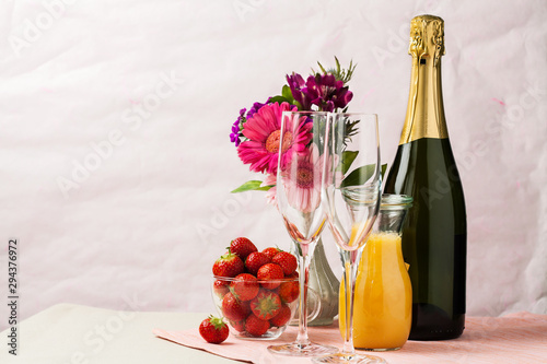 Mimosa cocktail and strawberries