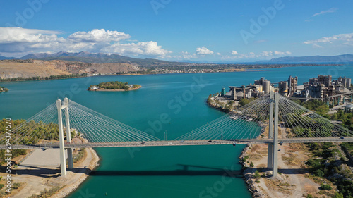 Aerial drone photo of famous new suspension bridge of halkida or Chalkida connecting mainland Greece with Evia island with beautiful clouds and blue sky, Greece