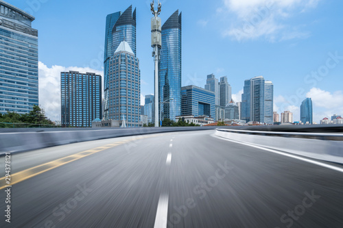 empty highway with cityscape and skyline of qingdao China.