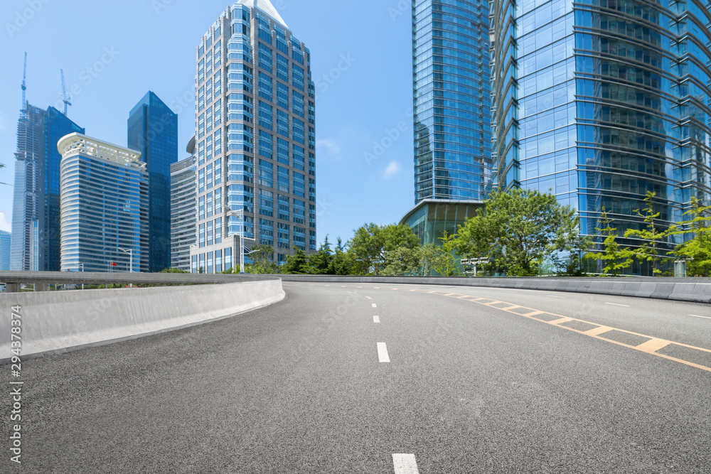 empty highway with cityscape and skyline of qingdao,China.