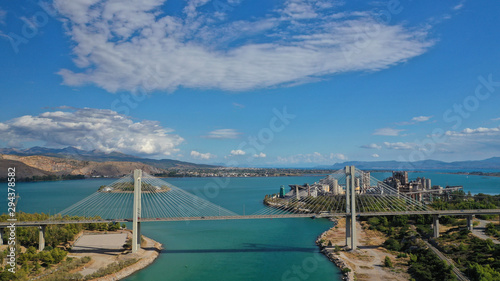 Aerial drone photo of famous new suspension bridge of halkida or Chalkida connecting mainland Greece with Evia island with beautiful clouds and blue sky  Greece