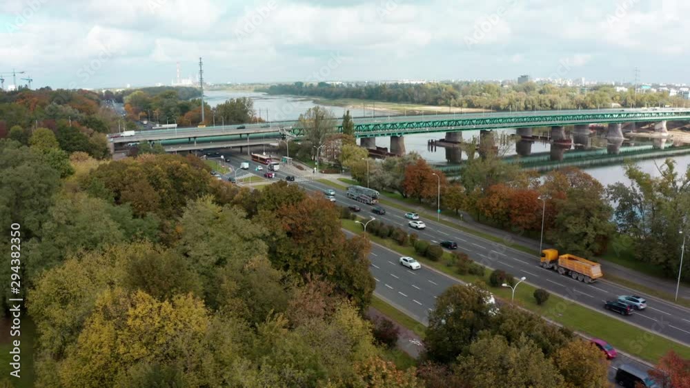 Aerial view of an epic shot from an unmanned aerial vehicle of a motorway leading to the Warsaw city center. Poland. Highway with several traffic lanes.