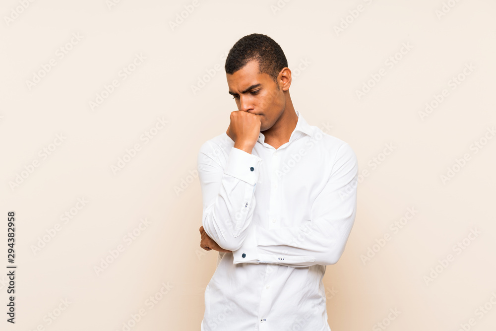 Young handsome brunette man over isolated background having doubts Young handsome brunette man over isolated background having doubts