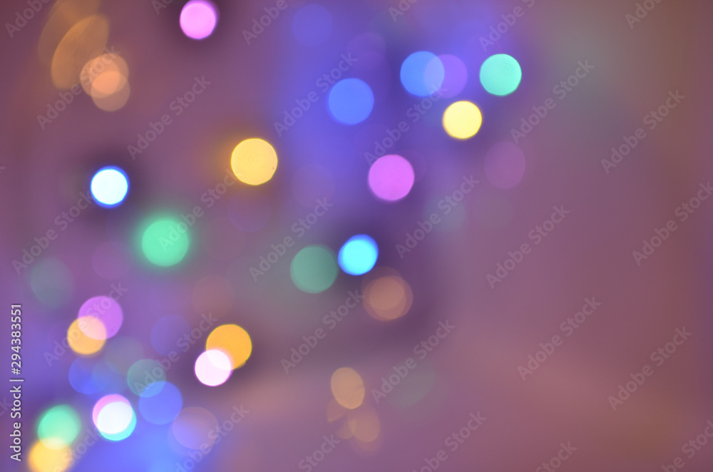 Night city lights on Christmas night. New Year, colored garland in defocus. Multi-colored bokeh on a light background for Photoshop.