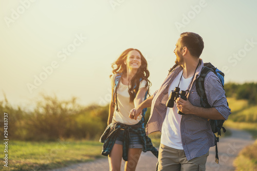 Happy couple is hiking in mountain. photo