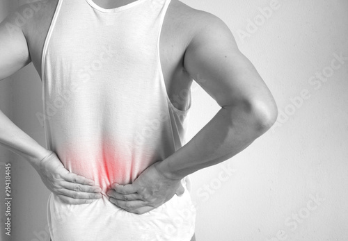 Man suffering from back pain.