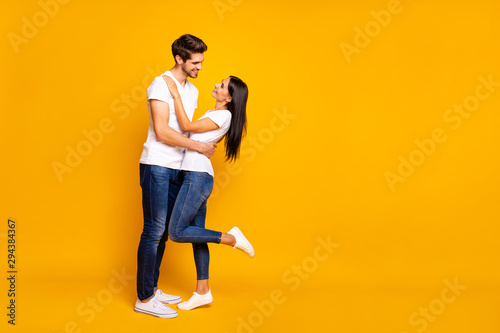 Full body photo of amazing pair slow dancing at prom night party looking eyes wear casual outfit isolated yellow color background