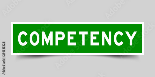 Label square green sticker in word competency on gray background (vector)