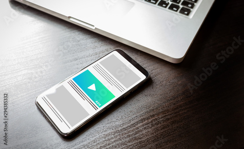 Native Advertising and Programmatic targeting marketing - Cross-device and multi target ads strategy. Mobile smart phone with ads effect on the screen