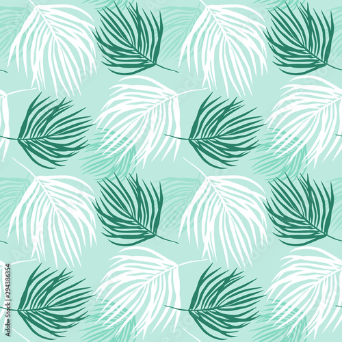 tropical print in pastel colors, seamless pattern of palm leaves on a pale green background.