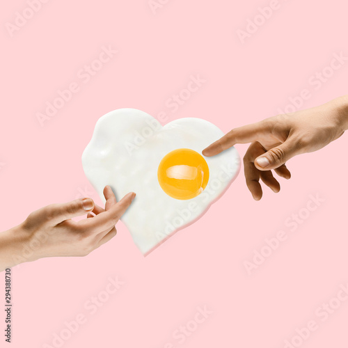 An alternative food. Touch of God - two hands and fried egg against trendy coral background. Negative space to insert your text. Modern design. Contemporary colorful and conceptual bright art collage.