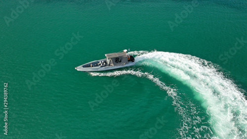 Aerial drone photo of luxury inflatable rib speed boat cruising in mediterranean open sea © aerial-drone