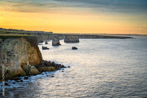 Marsden Bay at Sunset, located near South Shields, consisting of a sandy beach enclosed by Magnesian Limestone Cliffs and sea stacks