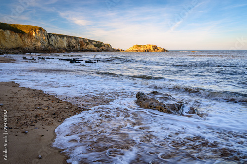 Retreating Wave at Marsden Bay, located near South Shields, consisting of a sandy beach enclosed by Magnesian Limestone Cliffs and sea stacks photo