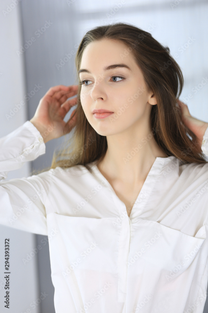 Portrait of young and beautiful business woman or student girl. Headshot of lady Portrait of young and beautiful business woman or student girl. Headshot of lady
