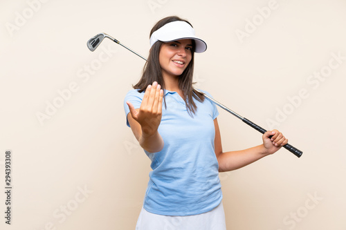 Young golfer woman over isolated background inviting to come with hand. Happy that you came