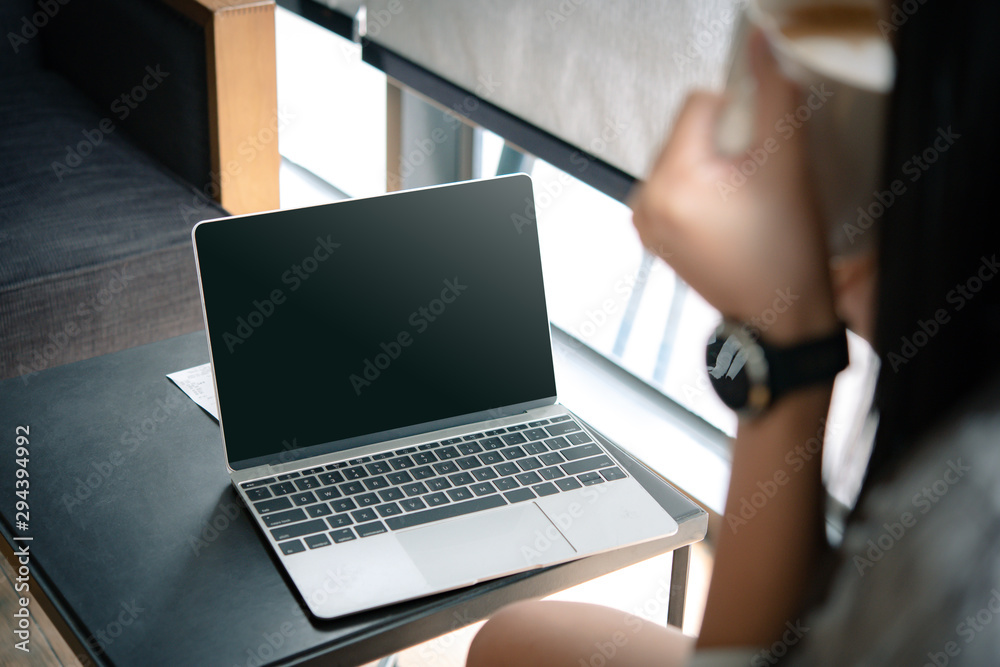 business woman working on computer with empty blank screen in the coffee shop, Concept freedom of work. business woman working on computer with empty blank screen in the coffee shop, Concept freedom of work.